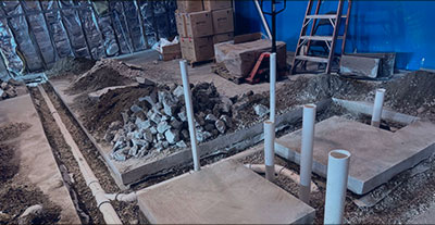 New plumbing system installation with PVC pipes in concrete foundation for home or commercial building in the DMV area