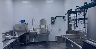 Commercial kitchen with stainless steel sinks and plumbing systems installed by DMVCrystal Plumbing in Maryland or Virginia