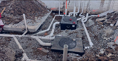 Sump pump installation with PVC piping in basement or foundation for flood prevention in Maryland or Virginia homes