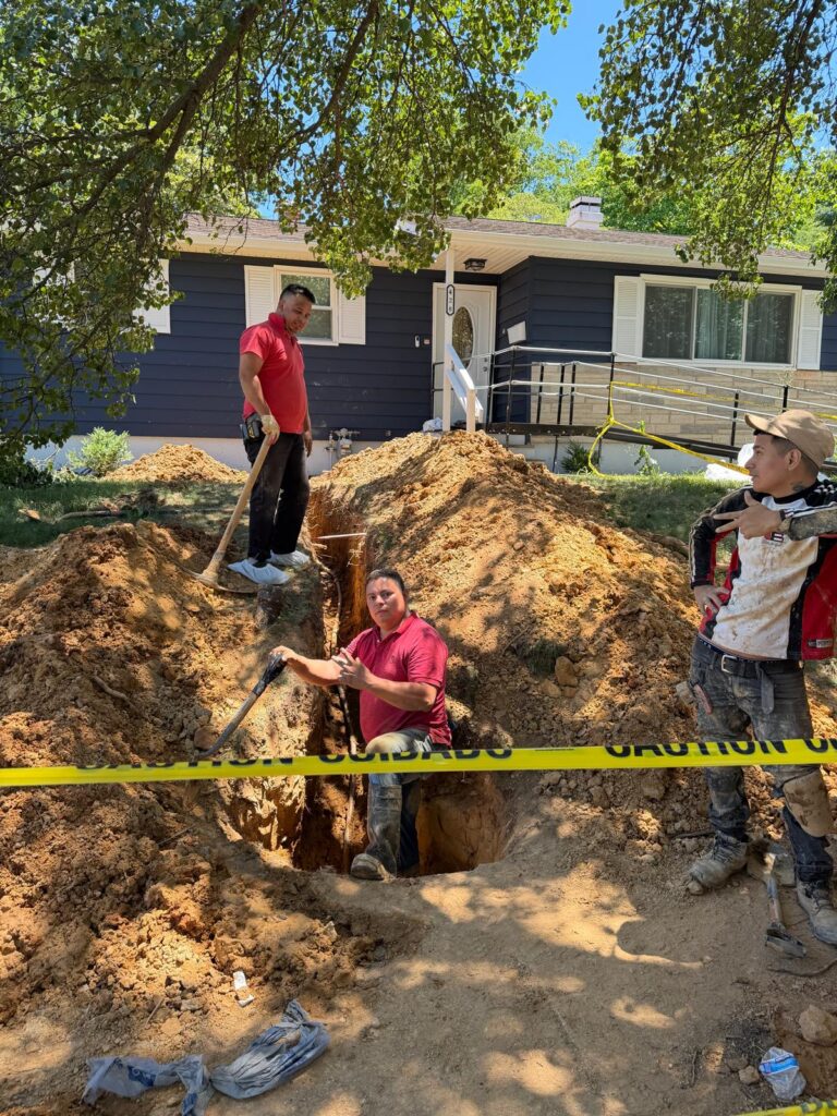 DMV Crystal Plumbing team excavating for residential water service replacement